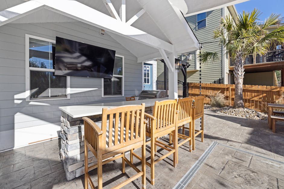 Newly installed stone patio in a backyard setting